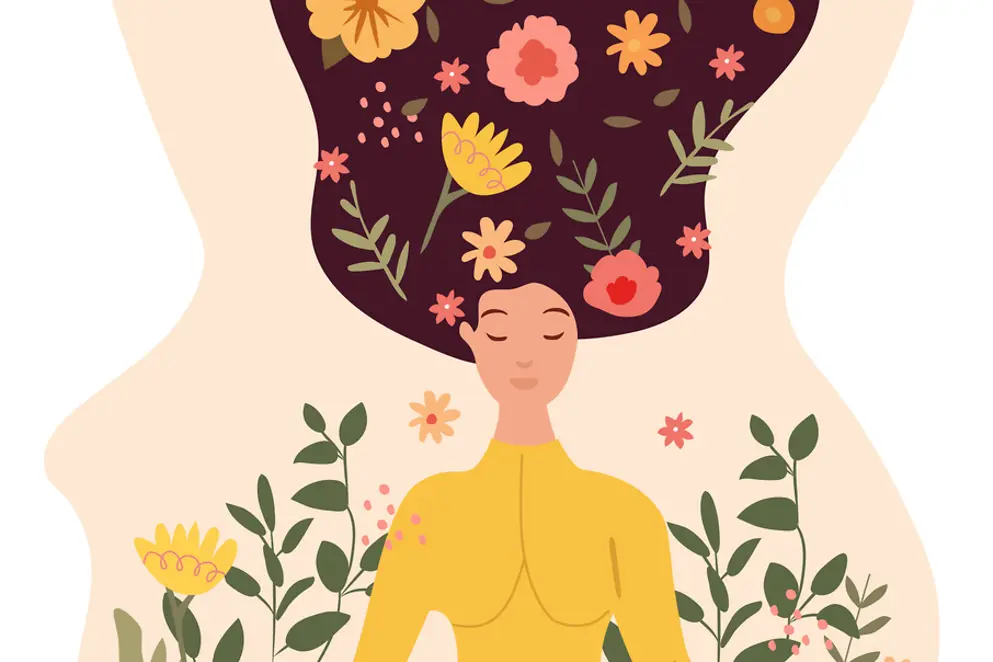 Eine Frau meditiert in einer Yoga-Lotus-Position, umgeben von Blättern und Blumen